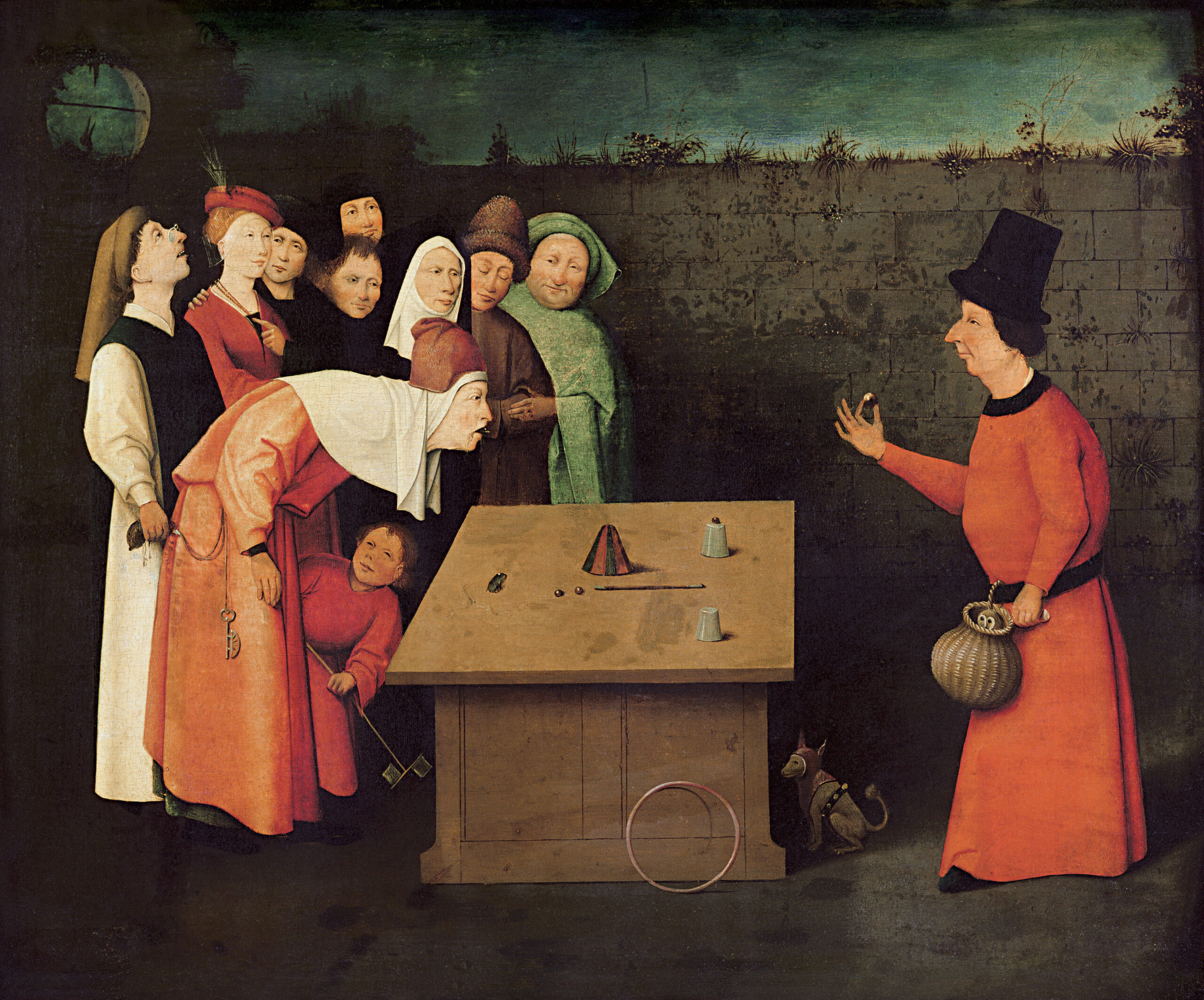 Hieronymus Bosch - Sztukmistrz. Obraz przedstawia scenę na której  uliczny iluzjonista oczarowuje